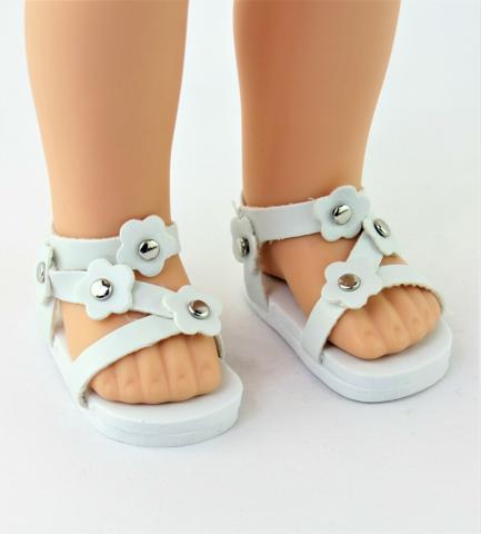Smaller doll size. Fits 14.5" dolls like Wellie Wishers. White flower sandals.