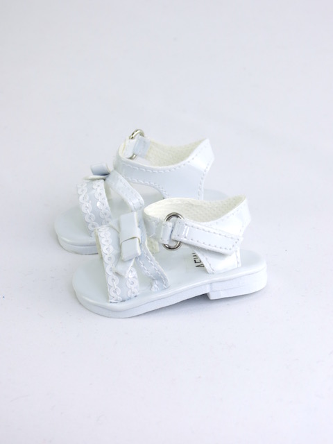 Favorite white deluxe sequin bow sandals for 18 inch dolls. Velcro closure.